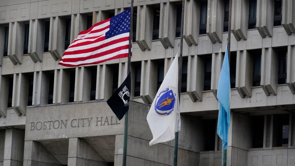 Flags fly above Boston City Hall