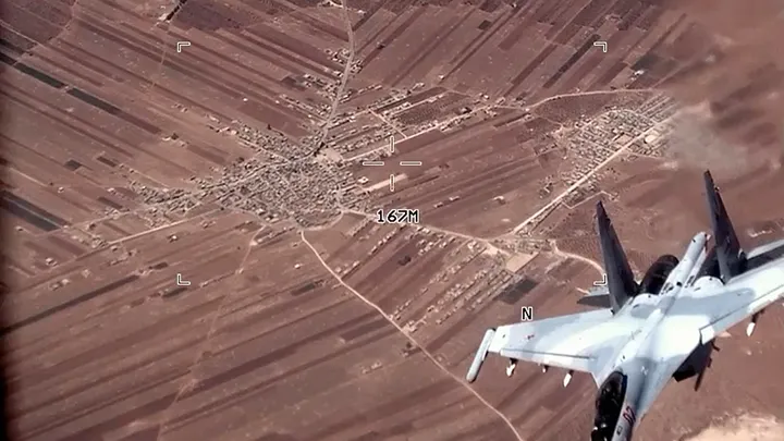 U.S. Air Force, a Russian SU-35 flies near a U.S. Air Force MQ-9