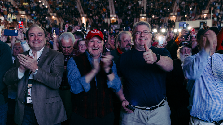 Audience members react during former President Trump's speech at the NRA's Great American Outdoor Show