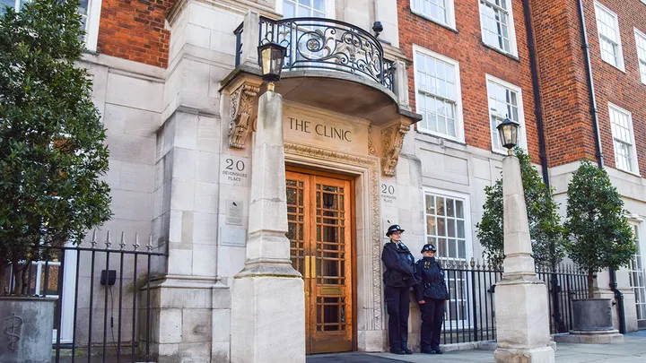 Police officers stand outside the private London Clinic
