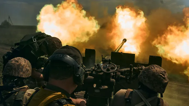 Ukrainian soldiers fire a gun near Bakhmut in the Donetsk region of Ukraine on May 15, 2023.